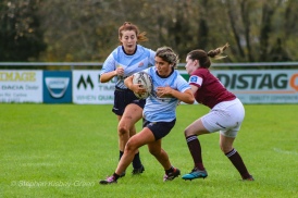 Zoe Valentine attempts to run around the Tullow RFC defence. Photo: Stephen Kisbey-Green