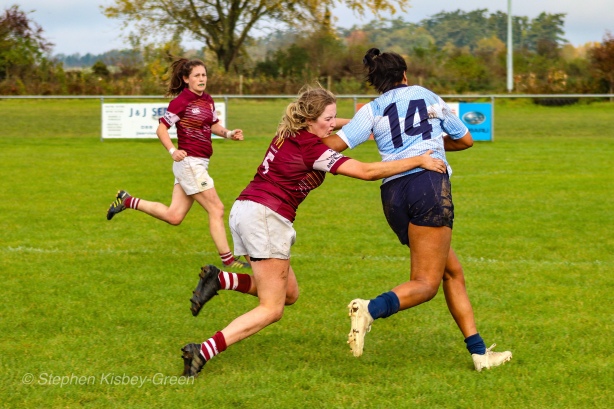 Eimear Corri brushes off a strong tackle attempt en route to the tryline. Photo: Stephen Kisbey-Green