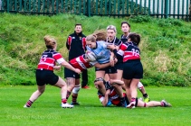 Nikki Gibson attempts to break the Wicklow tackle after making a good steal on her own line. Photo: Stephen Kisbey-Green