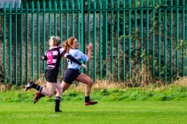 Louise McCleery runs around the outside of Old Belvedere RFC’s cover defense. Photo: Stephen Kisbey-Green