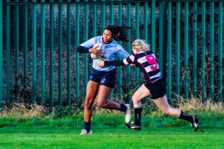 Eimear Corri brushes off an Old Belvedere RFC defender on the way to scoring her fourth try. Photo: Stephen Kisbey-Green