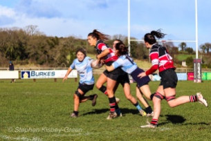 A good run from Wicklow RFC is shut down by DCU’s cover defense. Photo: Stephen Kisbey-Green
